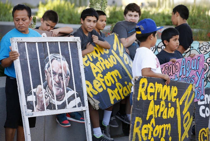 In this Wednesday, May 25, 2016 file photo, protesters rally in front of Maricopa County Sheriff’s Office Headquarters in Phoenix. CREDIT: AP/ROSSD. FRANKLIN