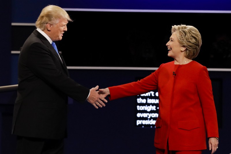 Republican presidential nominee Donald Trump and Democratic presidential nominee Hillary Clinton shake hands during the first presidential debate. CREDIT: AP Photo/David Goldman