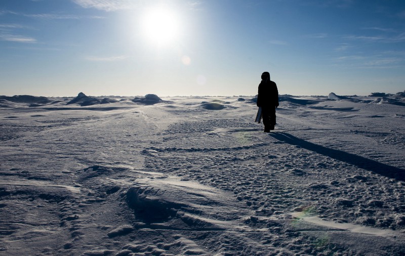 A researcher walks on Arctic ice. CREDIT: U.S. Navy/Petty officer 2nd class Tyler N. Thompson