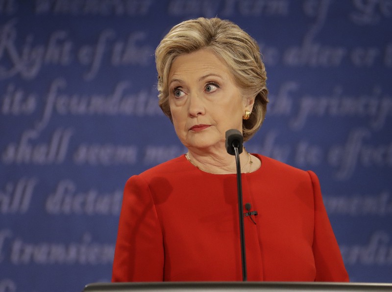 Democratic presidential nominee Hillary Clinton listens to Republican presidential nominee Donald Trump during the presidential debate at Hofstra University in Hempstead, N.Y., Monday, Sept. 26, 2016. CREDIT: AP Photo/Julio Cortez
