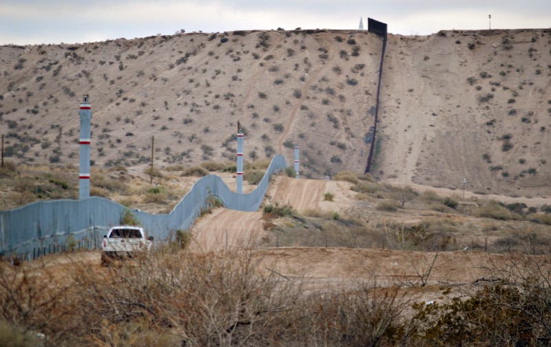 A U.S. Border Patrol agent drives near the U.S.-Mexico border fence in Sunland Park, N.M. CREDIT: AP Photo/Russell Contreras, File