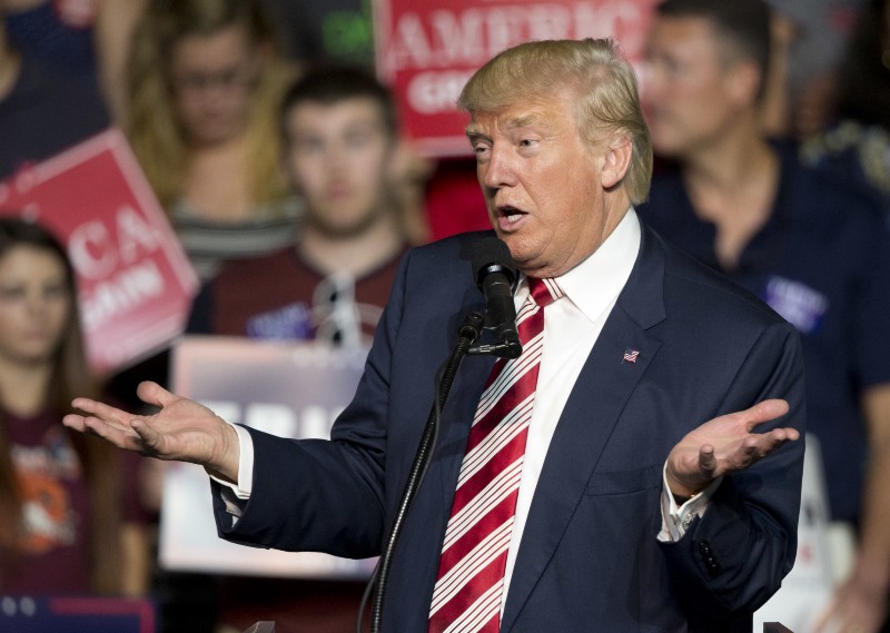 Republican presidential candidate Donald Trump gestures to the crowd during a rally in Roanoke, Va. on Saturday.. Trump faces Democratic opponent Hillary Clinton in the first of three debates Monday. CREDIT: AP PHOTO/STEVE HELBER