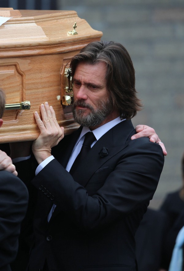 Jim Carrey carries the coffin of his ex-girlfriend Cathriona White as they walk to Our Lady of Fatima Church, in her home village of Cappawhite, Co Tipperary, Ireland, ahead of her funeral, Saturday Oct. 10, 2015. CREDIT: AP