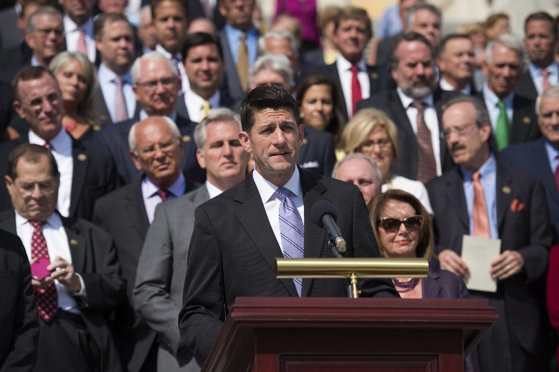 House Speaker Paul Ryan of Wis., joined by House members, speaks during a ceremony on Capitol Hill in Washington, Friday, Sept. 9, 2016, marking the 15th anniversary of the Sept. 11 attacks. CREDIT: AP PHOTO/MOLLY RILEY
