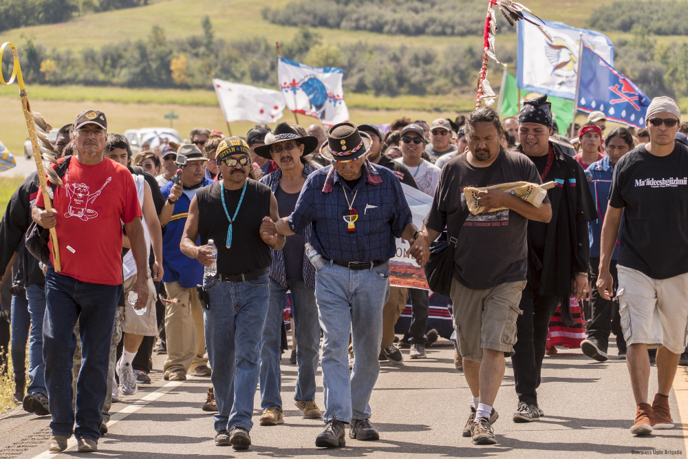 Scores of Native Americans march against the Bakken pipeline, or Dakota Access pipeline. CREDIT: FLICKR/JOE BRUSKY