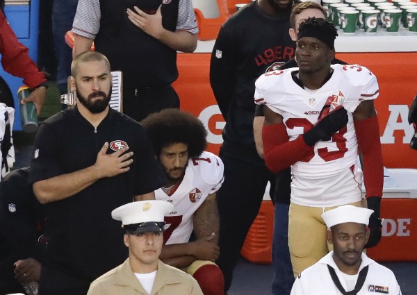 Colin Kaepernick kneels during the national anthem, Sept. 1, 2016. CREDIT: CHRIS CARLSON/AP