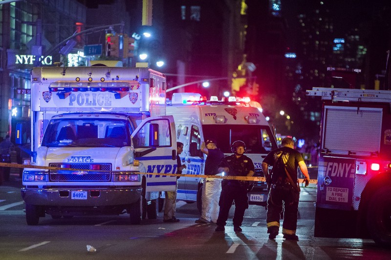 Police and firefighters work near to the scene in Manhattan, New York, Saturday, Sept. 17, 2016. CREDIT: AP PHOTO/ANDRES KUDACKI)