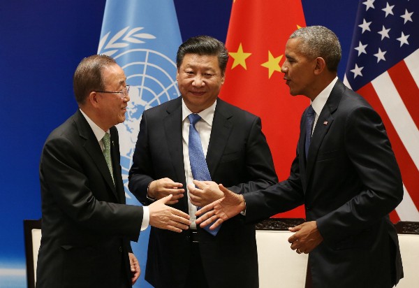 President Barack Obama, right, and U.N. Secretary-General Ban Ki-moon shake hands in front of Chinese President Xi Jinping during a joint ratification of the Paris climate change agreement. CREDIT: How Hwee Young/Pool Photo via AP