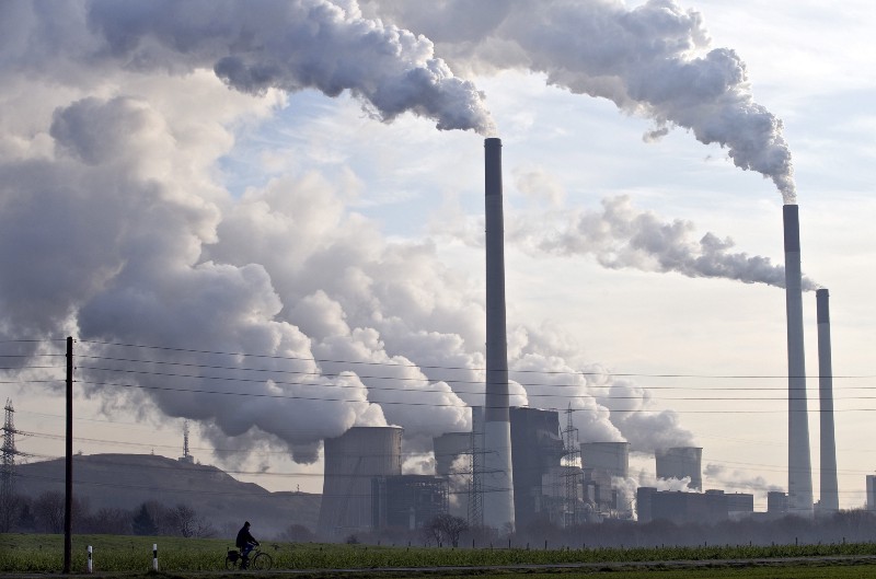 Steam and smoke over a coal burning power plant in Gelsenkirchen, Germany. CREDIT: AP/Martin Meissner