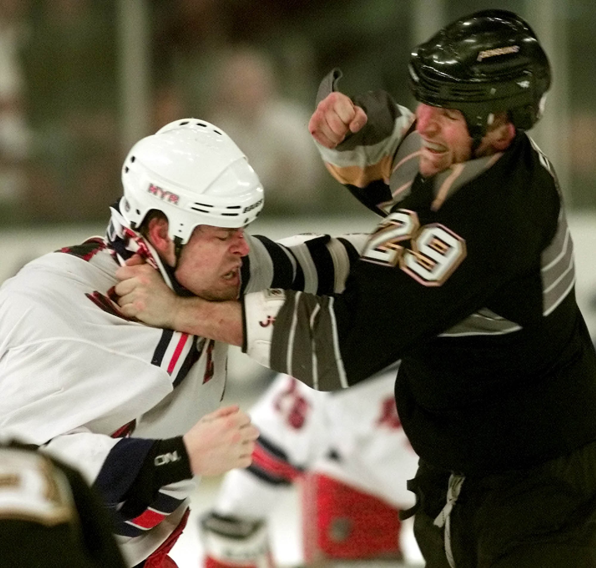 New York Rangers’ Dale Purinton connects with a right to the chin of Pittsburgh Penguins’ Stephen Peat during a first period brawl Saturday, Jan. 26, 2002, at Madison Square Garden in New York. CREDIT: Ed Betz, AP