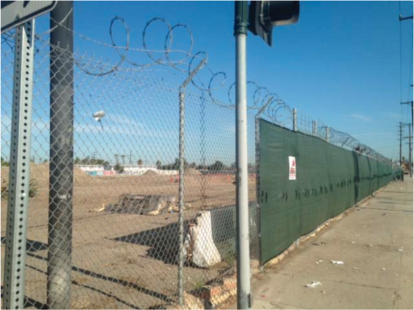 Left: an image of a windscreen shown to residents by HACLA before the demolition. Right: An actual windscreen on the construction site, leaving parts exposed.