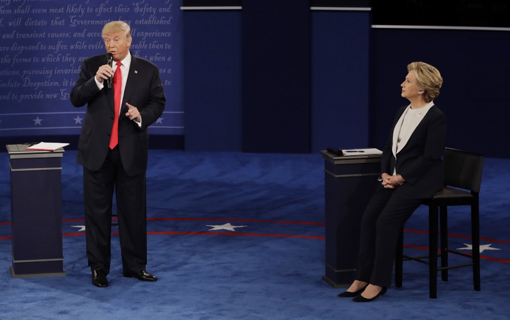 Presidential candidates Donald Trump and Hillary Clinton square off during the second presidential debate. CREDIT: AP Photo/Patrick Semansky