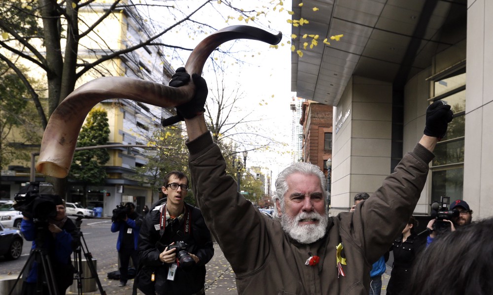 Brand Thornton celebrates after hearing a verdict outside federal court in Portland, Ore., Thursday, Oct. 27, 2016. A jury exonerated brothers Ammon and Ryan Bundy and five others of conspiring to impede federal workers from their jobs at the Malheur National Wildlife Refuge. CREDIT: AP Photo/Don Ryan