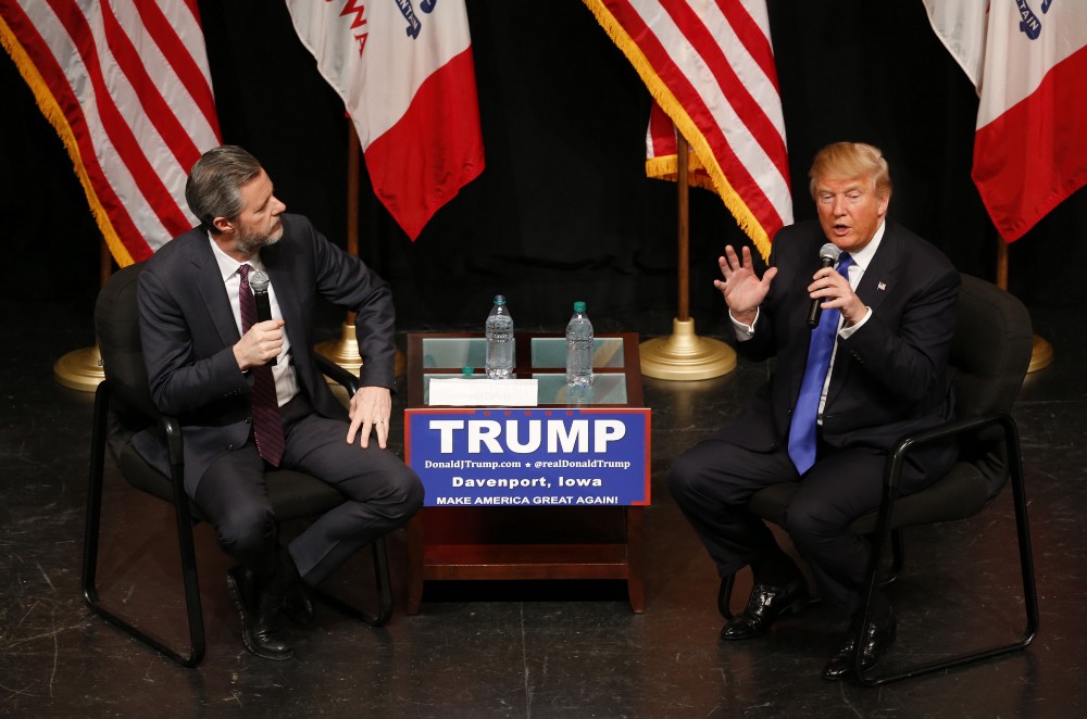 Jerry Falwell with Donald Trump in Iowa. CREDIT: AP /Paul Sancya