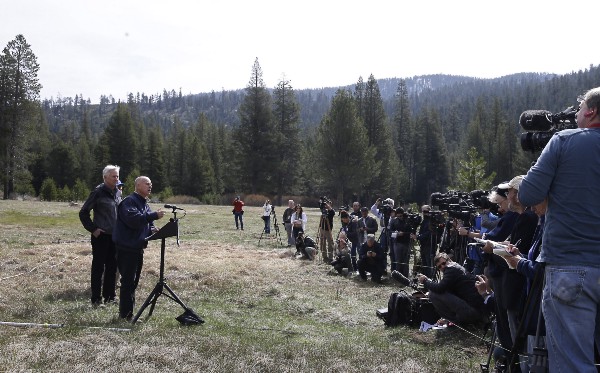 Gov. Jerry Brown talks to reporters in 2015 about the executive order he signed requiring the state water board to implement measures in cities and towns to cut water usage by 25 percent compared with 2013 levels. CREDIT: AP/Rich Pedroncelli