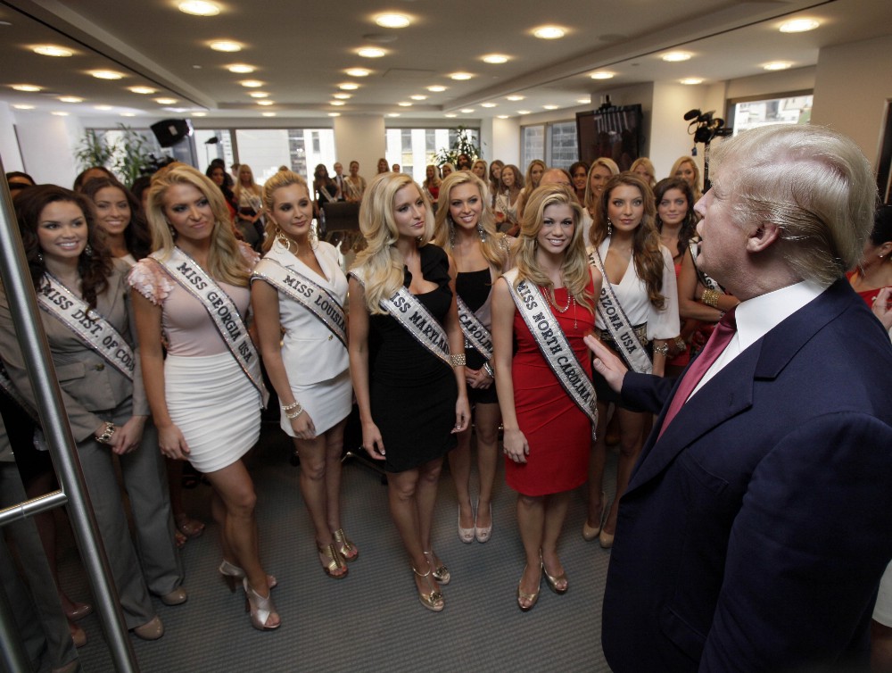 Donald Trump addresses Miss USA contestants in a conference room in Trump Tower, during their to New York, Wednesday, May 25, 2011. CREDIT: AP Photo/Richard Drew