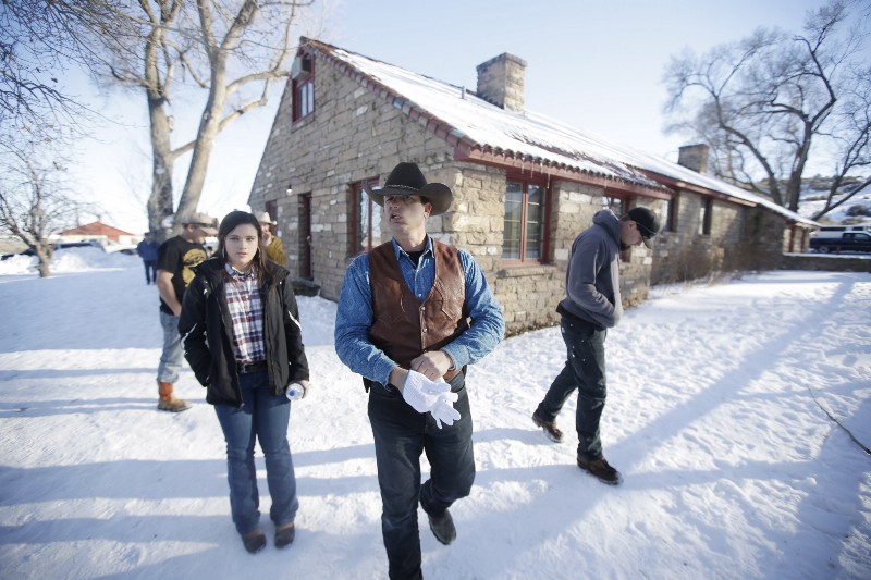 Ryan Bundy, center, one of the sons of Nevada rancher Cliven Bundy, walks through the Malheur National Wildlife Refuge in January. CREDIT: AP Photo/Rick Bowmer