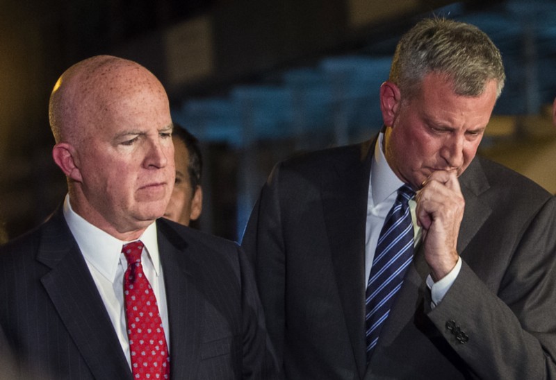 Commissioner O’Neill (left) and Mayor de Blasio. CREDIT: AP Images