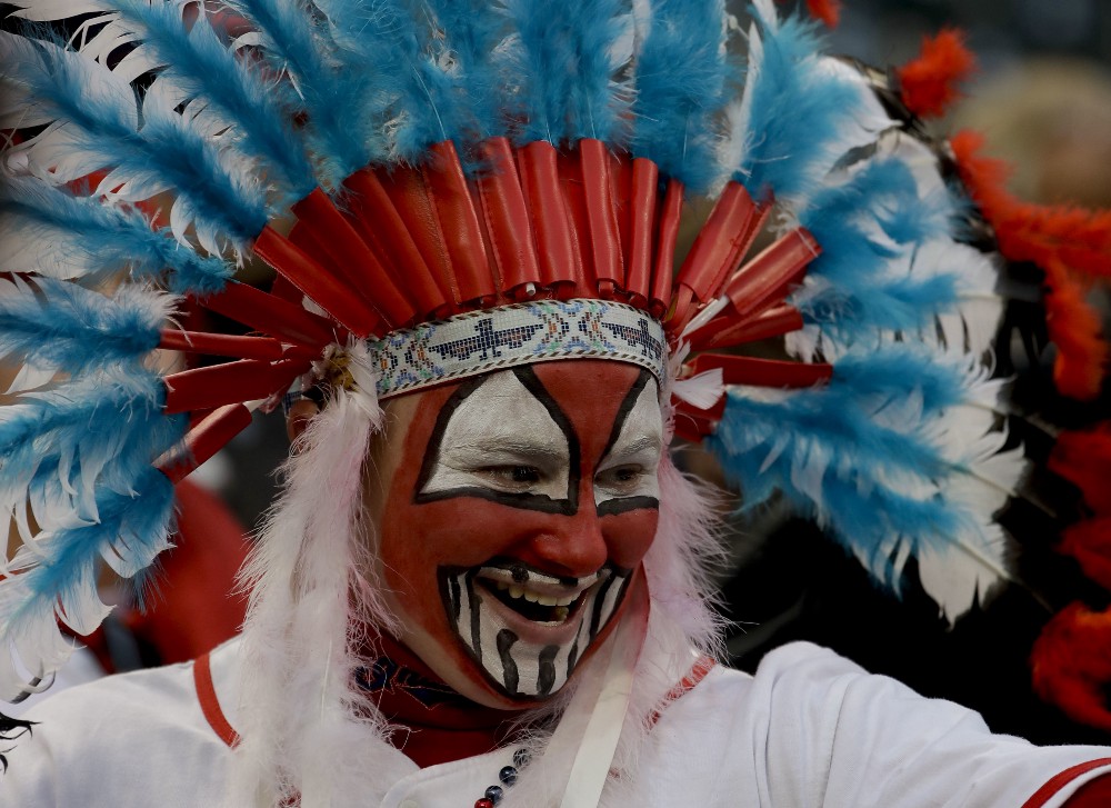 A Cleveland Indians fan watches during batting practice before Game 1 of the Major League Baseball World Series against the Chicago Cubs Tuesday, Oct. 25, 2016, in Cleveland. CREDIT: AP Photo/Matt Slocum