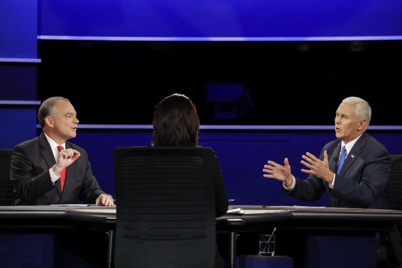 Republican vice-presidential nominee Gov. Mike Pence, and Democratic vice-presidential nominee Sen. Tim Kaine discuss a question during the vice-presidential debate at Longwood University in Farmville, Va., Tuesday, Oct. 4, 2016. CREDIT: AP Photo/David Goldman