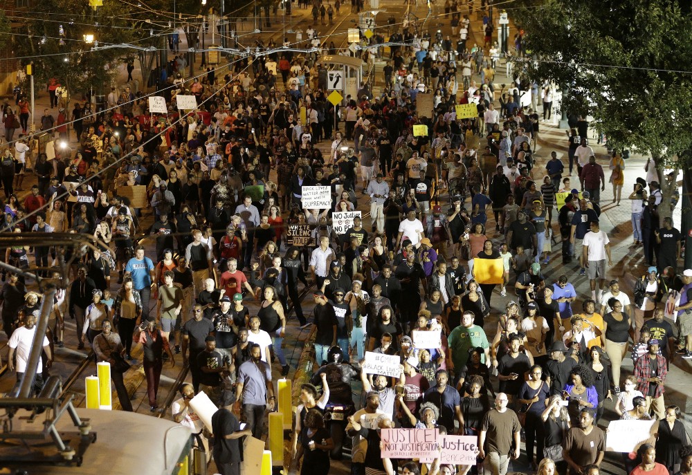 In September, demonstrators protested the fatal police shooting of Keith Lamont Scott in Charlotte, N.C. CREDIT: AP Photo/Chuck Burton