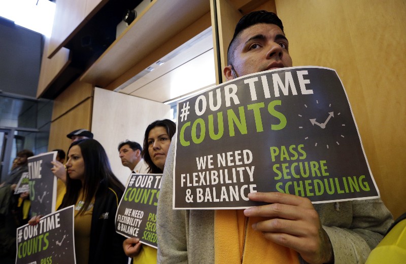 Supporters of Seattle’s scheduling ordinance at a city council meeting in September. CREDIT: AP Photo/Elaine Thompson