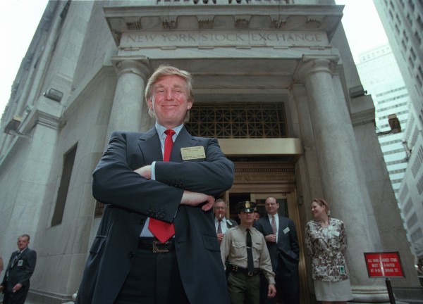 Donald Trump outside the New York Stock Exchange after the listing of his stock in 1995. CREDIT: AP Photo/Kathy Willens