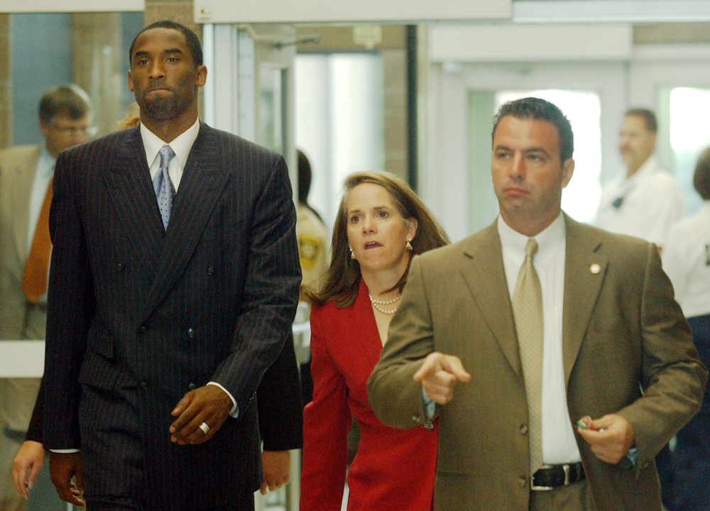 Kobe Bryant with Jose Revilla, right, a member of his security team, and his attorney Pamela Mackey, center. Monday, July 19, 2004. CREDIT: Helen D. Richardson, AP