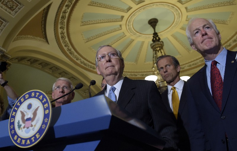 South Dakota Sen. John Thune (second from right) is among the many prominent Republican senators to abandon Trump this weekend, while continuing to help Majority Leader Mitch McConnell (center) keep a Supreme Court seat empty in hopes the GOP can win in November. (CREDIT: AP Photo/Susan Walsh, File)