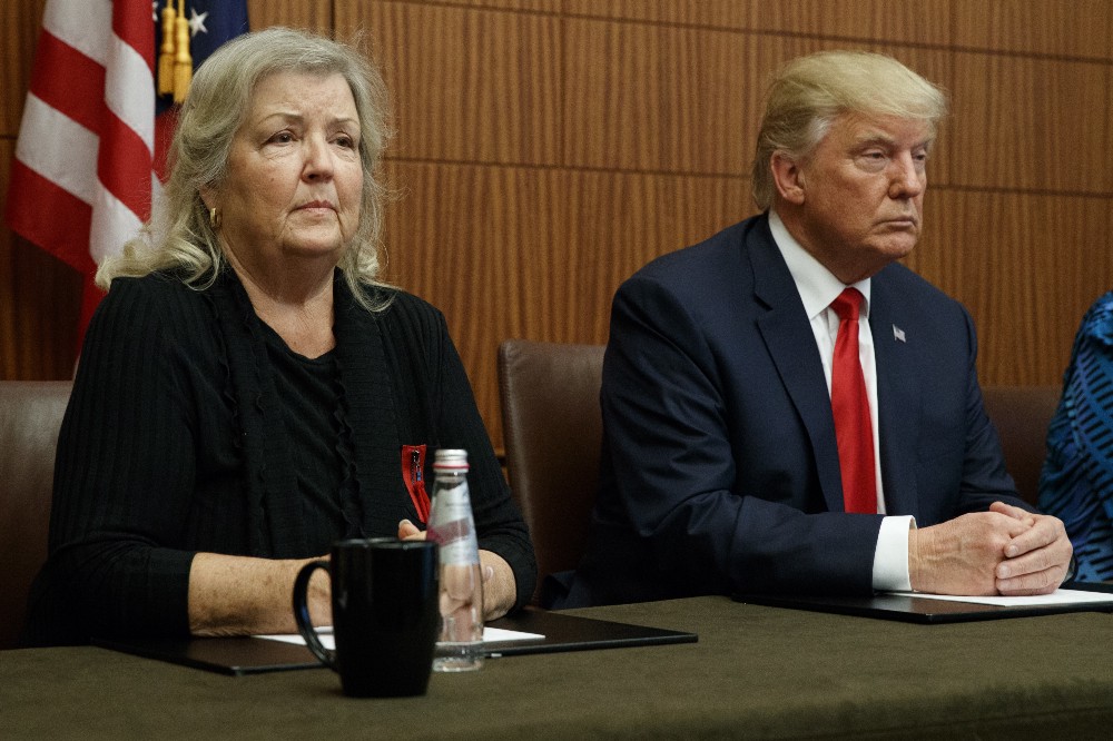 Republican presidential candidate Donald Trump, right, listens as Juanita Broaddrick, who has accused former President Bill Clinton of sexual assault, speaks before the second presidential debate against democratic presidential candidate Hillary Clinton. CREDIT: AP Photo/ Evan Vucci