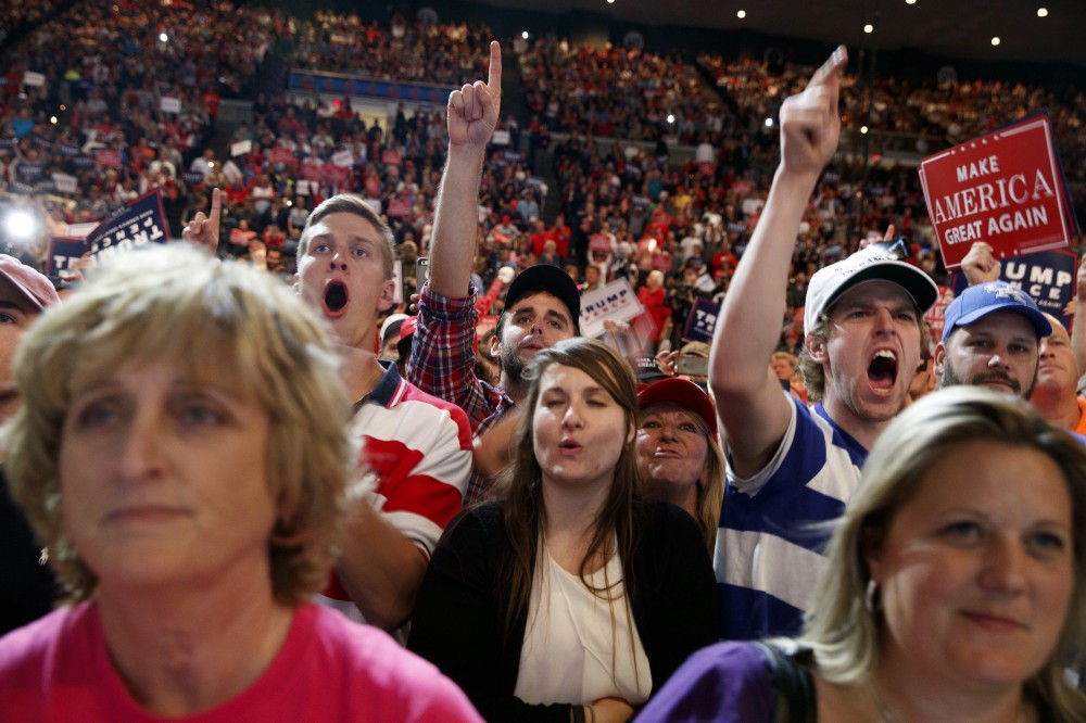 Supporters of Republican presidential candidate Donald Trump cheer during a campaign rally, Thursday, Oct. 13, 2016, in Cincinnati, Ohio. CREDIT: AP Photo/Evan Vucci