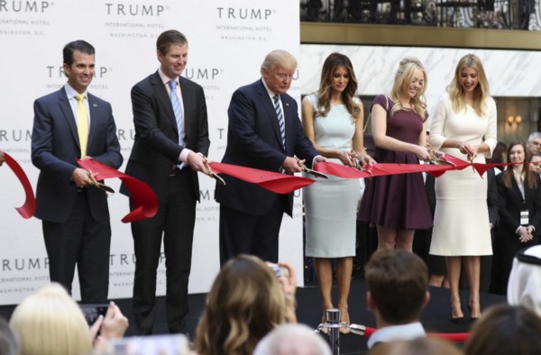 Donald Trump, along with his wife and adult children, at the grand opening of the Trump International Hotel in Washington, D.C., in the midst of his presidential campaign. CREDIT: AP Photo/Manuel Balce Ceneta