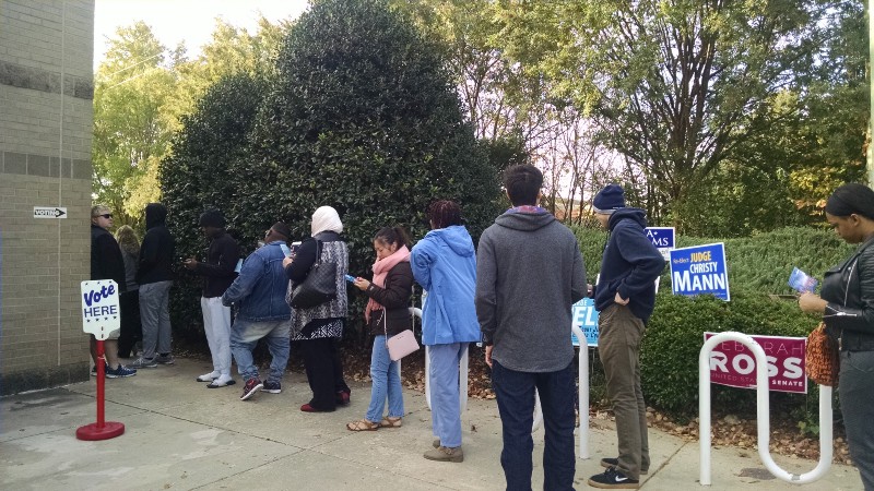 Voters waiting outside the Mecklenburg County Library In Charlotte. CREDIT: Erica Hellerstein