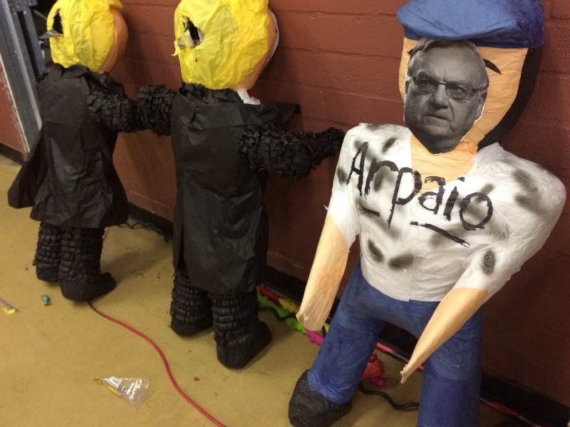 Joe Arpaio and Donald Trump piñatas await a beating at the Bazta Arpaio watch party. CREDIT: Alice Ollstein