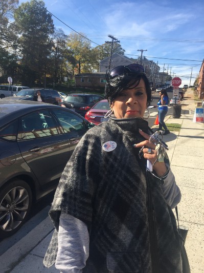 From left: Adé Inniss, Markus Batchelor, and Linda Green, on Election Day in Southeast D.C. CREDIT: Natasha Geiling