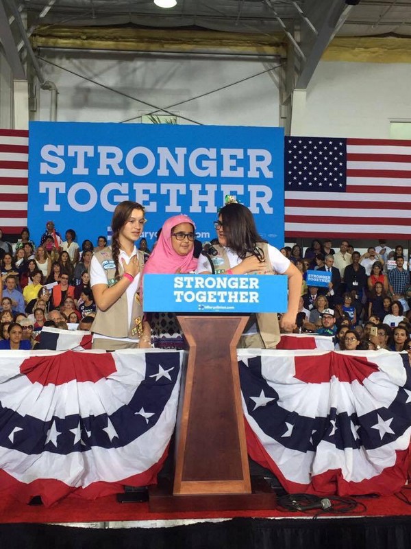 Cantu’s daughter (center) recites the pledge of allegiance at a Clinton rally. CREDIT: Olivia Cantu