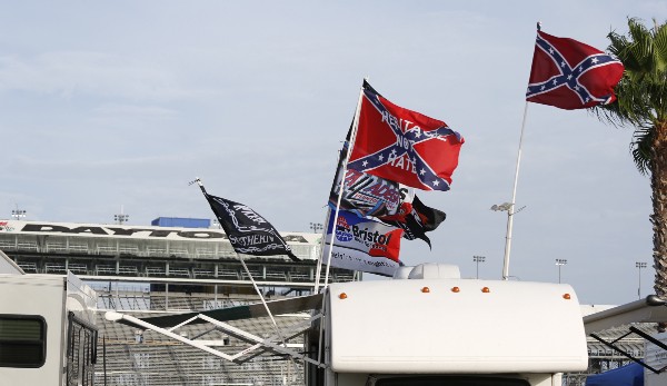 Confederate flags at the Sonoma (left) and Daytona (right) races, in the immediate weeks after the Charleston massacre. CREDIT: AP