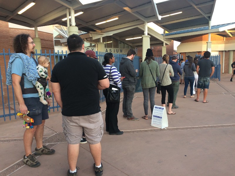 Broken electronic poll books created a line out the door at 7 a.m. at Tempe High School. CREDIT: Alice Ollstein
