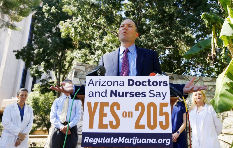 Supporters of legal recreational marijuana rally in Arizona two weeks before voters there decide if they will join Colorado, Washington, Oregon, and Alaska. CREDIT: AP Photo/Ross D. Franklin