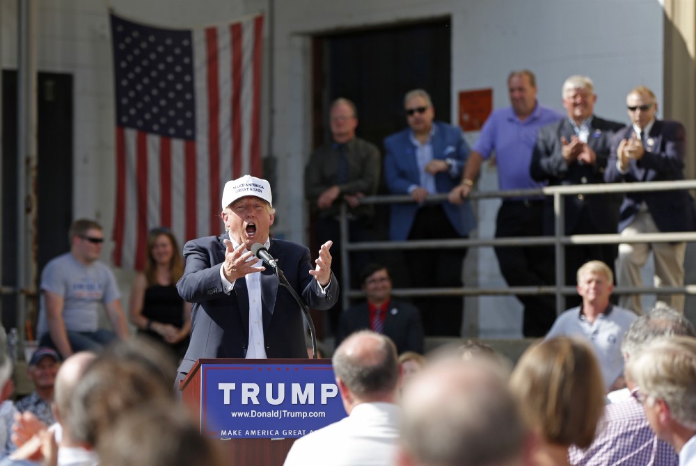 Donald Trump speaks at a lightbulb factory in June. CREDIT: AP Photo/Robert F. Bukaty