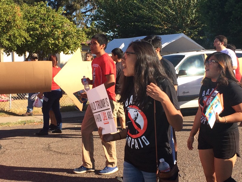 Daphne Cervantes marches in the streets with the Bazta Arpaio campaign. CREDIT: Alice Ollstein