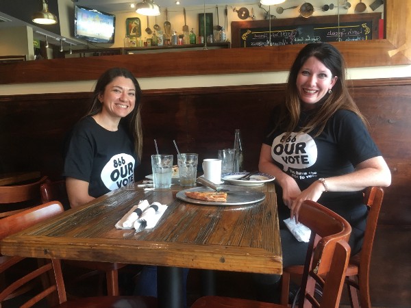 Morales and Brotz take a break from volunteering. CREDIT: Kira Lerner