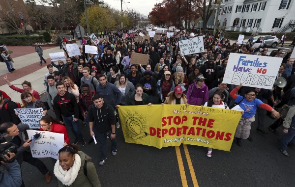 Hundreds of Rutgers University students block College Ave., in New Brunswick, N.J., as they march to protest some of President elect Donald Trump’s policies CREDIT: AP Photo/Mel Evans
