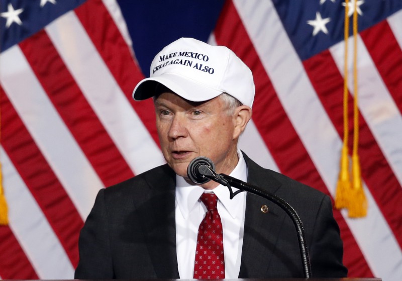 U.S. Sen. Jeff Sessions (R-AL) wears a “Make Mexico Great Again Also” hat prior to Republican presidential candidate Donald Trump’s speech during a campaign rally at the Phoenix Convention Center. CREDIT: AP Photo/Ross D. Franklin