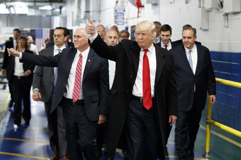 President-elect Donald Trump and Vice President-elect Mike Pence tour a Carrier plant. CREDIT: AP Photo/Evan Vucci