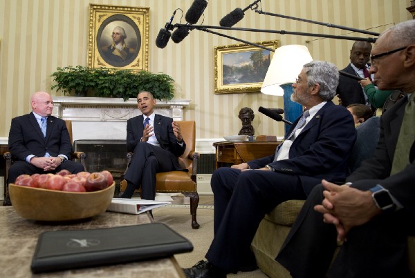 NASA Astronaut Scott Kelly, Obama, and Holdren in the Oval Office in 2016. CREDIT: AP Photo/Carolyn Kaster