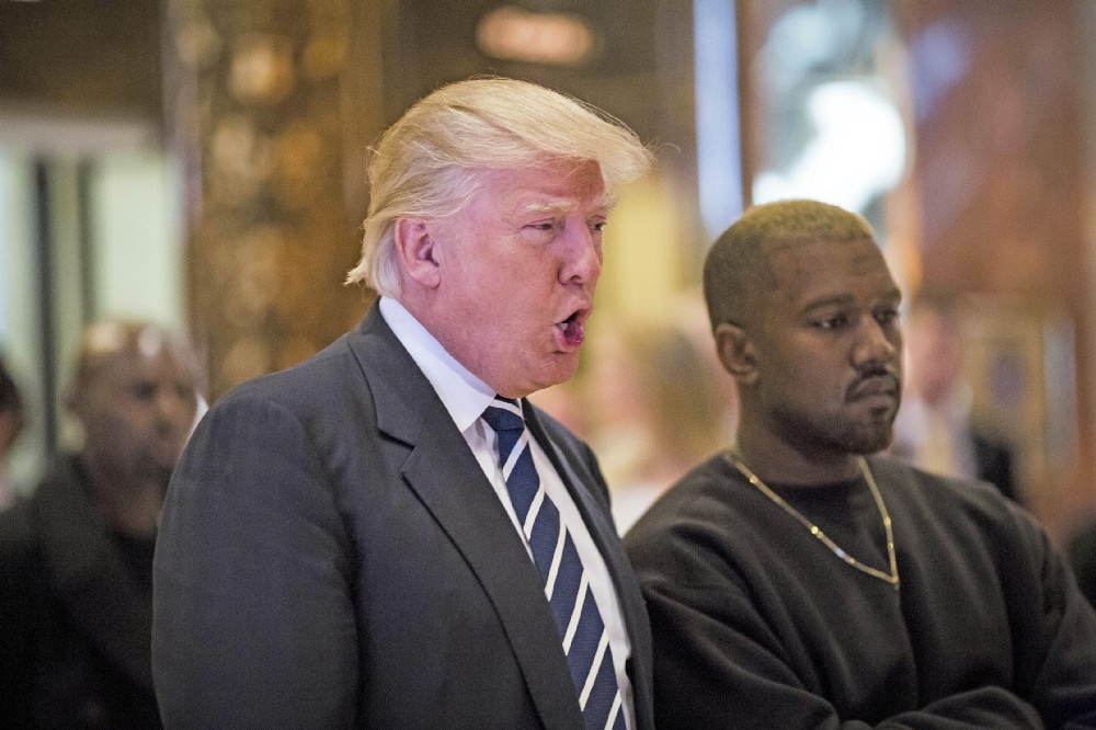 United States President-elect Donald J. Trump and Musician Kanye West pose for photographers in the lobby of Trump Tower in Manhattan, New York, U.S., on Tuesday, December 13, 2016. CREDIT: John Taggart / Pool via CNP / MediaPunch/IPX
