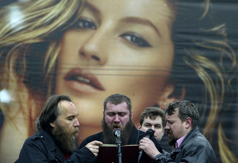 Alexander Dugin, the leader of the Eurasian Movement, left, and his supporters sing during a rally of Russian nationalist groups in central Moscow, Sunday, April 8, 2007. CREDIT: AP Photo/Ivan Sekretarev