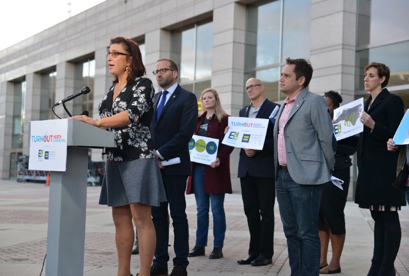 Trans activist Madison White stands with others advocating for change in North Carolina. CREDIT: Brian Gomsak/AP Images