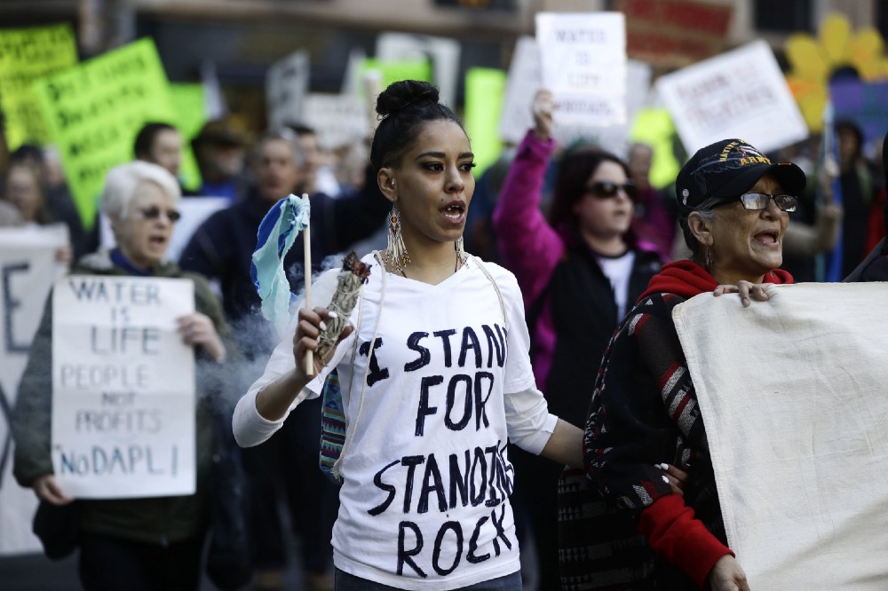 Protesters in Philadelphia demonstrate in solidarity with members of the Standing Rock Sioux tribe in North Dakota over the construction of the Dakota Access oil pipeline. CREDIT: AP Photo/Matt Rourke